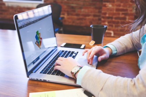 Graphic Designer working on a laptop